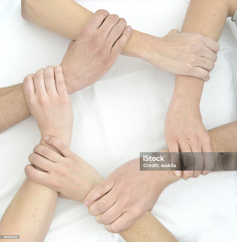 Trabajo en equipo mano con sujeción el uno en el otro en un círculo tocar - Foto de stock de Blanco - Color libre de derechos