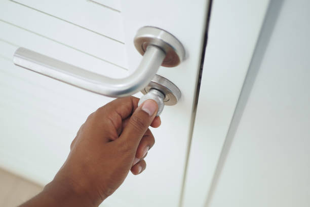istock Man's Hand Opening door close up 1852830048