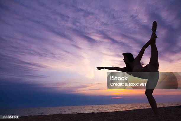 Modern Contemporary Dance Young Gymnast Woman At Sunset Beach Stock Photo - Download Image Now