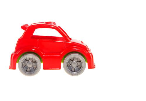 Red toy car on isolated white background