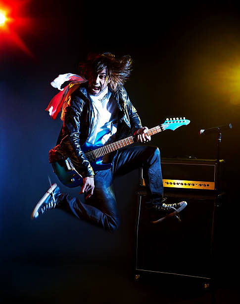 istock Young rock star jamming on a guitar 185283450