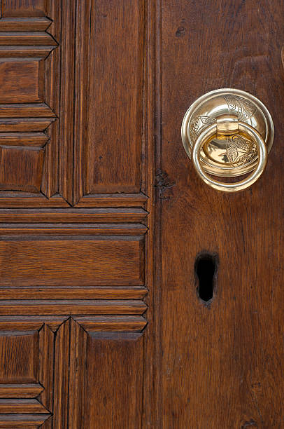 istock Vintage image of ancient door knocker on a wood 185283959