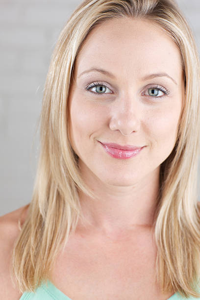 istock Smiling young woman looking at camera 185284237