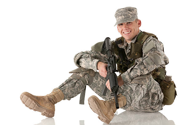 istock Army man sitting on the floor with a rifle 185284285