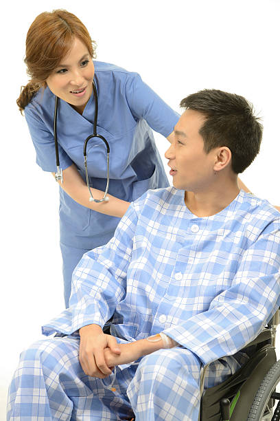 istock Female doctor attending a patient 185284298