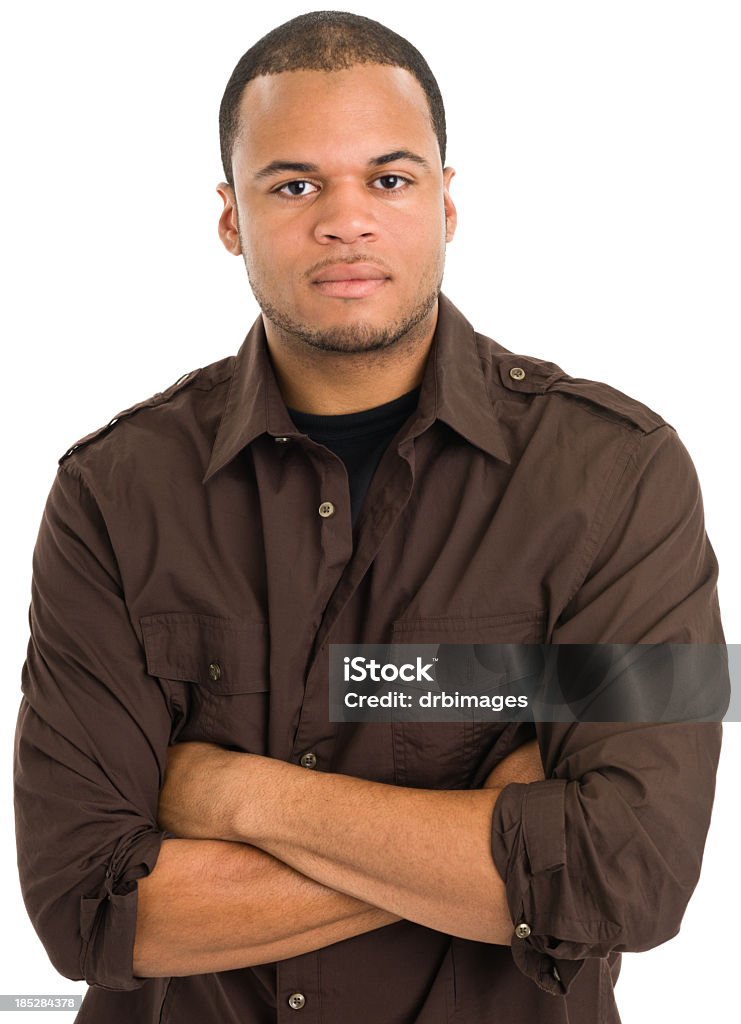 Tough Young Man With Arms Crossed Portrait of a young man on a white background. http://s3.amazonaws.com/drbimages/m/ns.jpg White Background Stock Photo