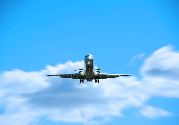 istock Airplane taking off or lands against bright sky 185284388