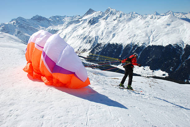 Launching paraglider in the Swiss Alps above Davos. Please see related images: