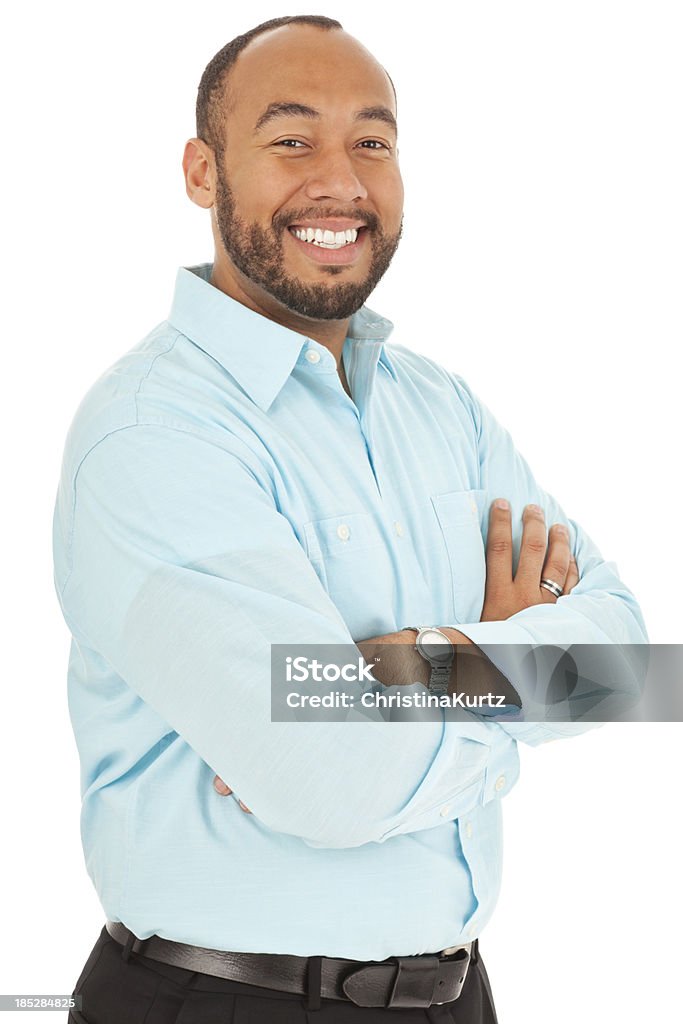 Casual homme de Race mixte souriant avec Bras croisés - Photo de Bleu libre de droits