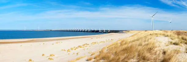 The Eastern Scheldt storm surge barrier (Oosterscheldekering) in the Dutch province of Zeeland. This is the largest of dams of the Delta Works. The Delta Works protect a large area of land around the Rhine, Meuse and Scheldt delta against flooding. After the disastrous North Sea flood of 1953, measures were taken to start the construction of the Delta Works.