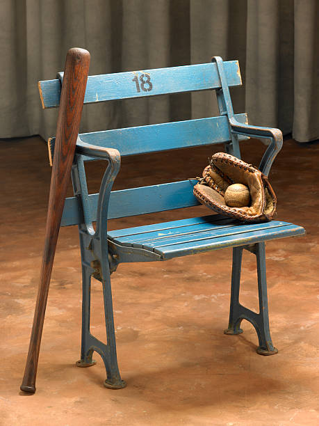 istock Antique stadium seat with old-time baseball equipment 185285337