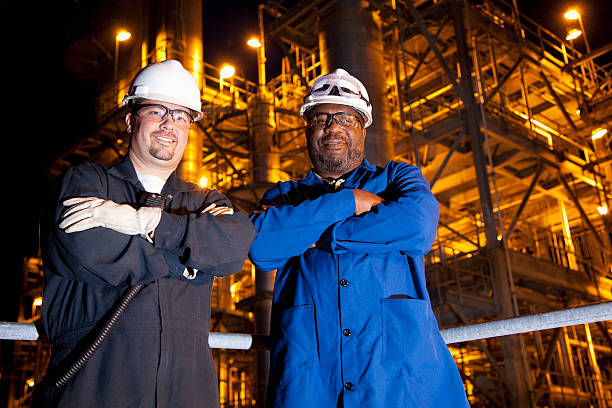 istock Chemical plant workers at night 185285649