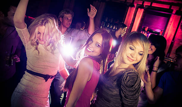 istock Friends Dancing At A Party 185285692