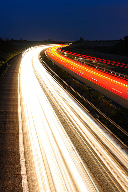 istock Blurred Motion of Car Lights on Highway at Night 185285725