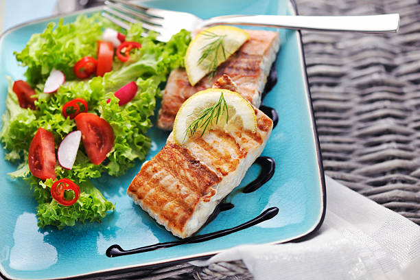 istock Grilled Salmon steak with fresh salad and balsamic vinegar sauce 185286049