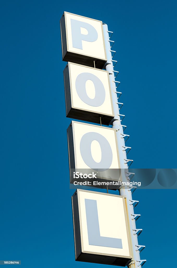 Route 66 Americana Classic Neon Motel Pool Sign A classic motel pool sign against a perfect blue sky. Neon Lighting Stock Photo
