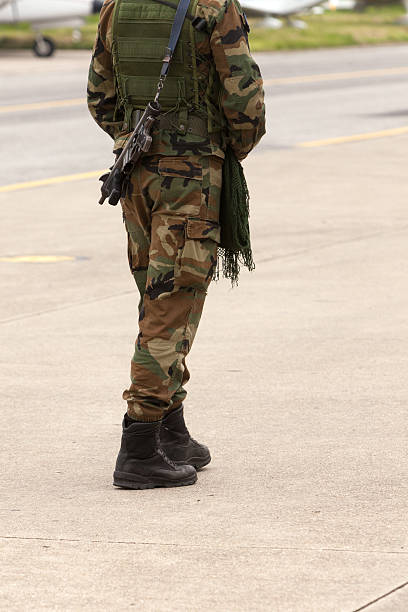 istock Armed soldier in airport 185286360
