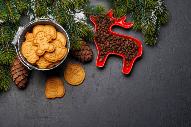 istock Christmas background with fir tree, gingerbread cookies, nuts, and copy space for greetings 1852864881