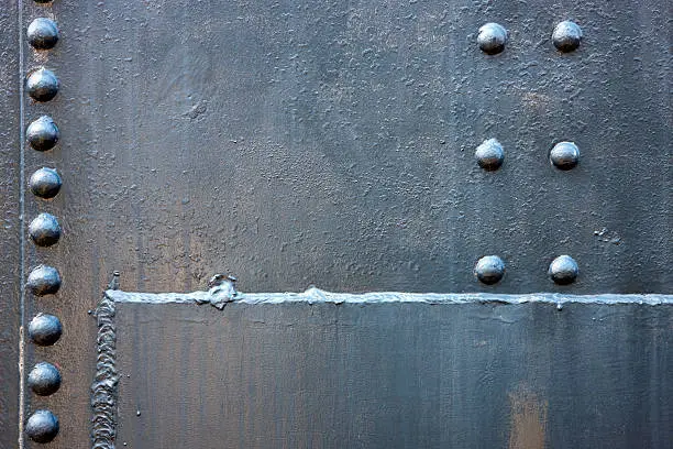 Photo of Welded Steel Background with Rivets