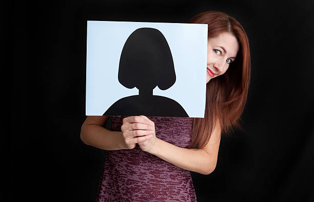 istock Woman Peeking Out From Generic Profile Picture 185287187