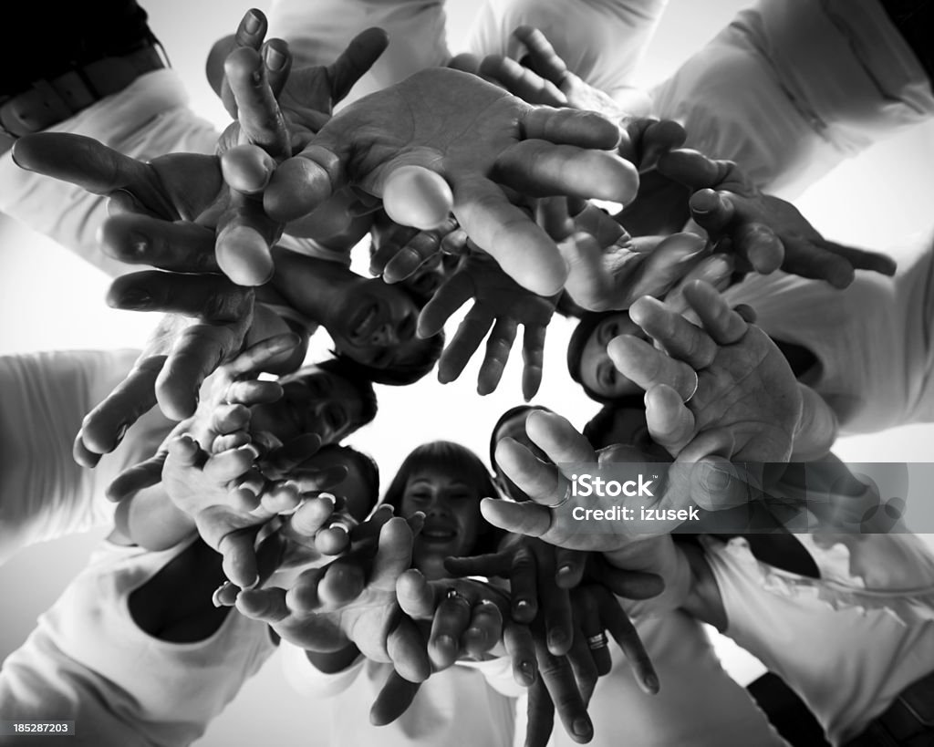 Human hands Group of women standing in the circle and directing their hands at the camera. Low angle view. Women's Rights Stock Photo