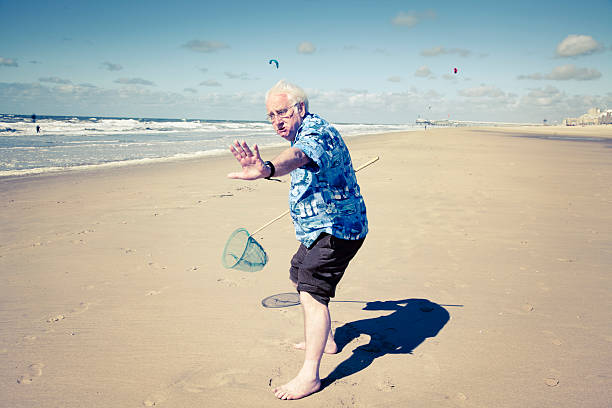 Funny Senior Tourist At Beach Stock Photo - Download Image Now - Candid,  Grumpy Old Man, Senior Men - iStock