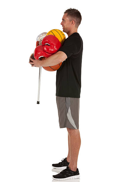 istock Man holding sports equipments 185287426