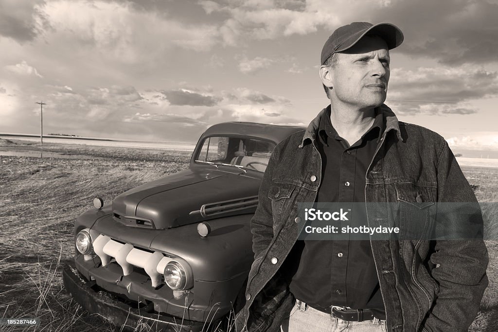 Vintage Farmer and Truck An image from the agriculture industry of a vintage farmer and truck. Farmer Stock Photo