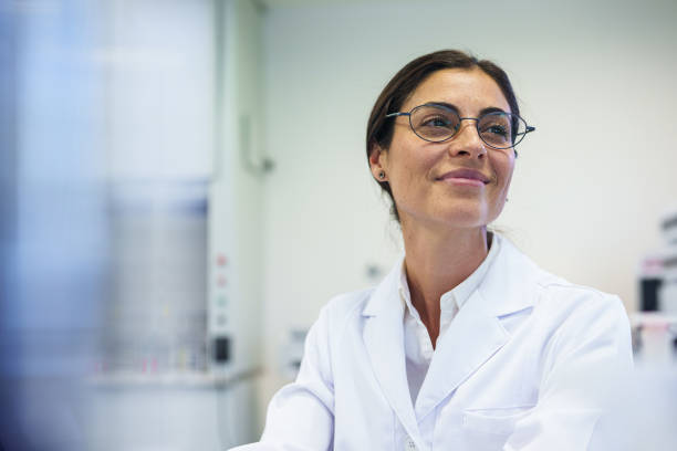 istock Female researcher working inside laboratory facility 1852880581