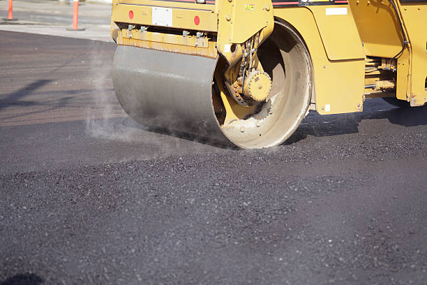 Asphalt "Street Repair in Vancouver, Canada." flattening stock pictures, royalty-free photos & images