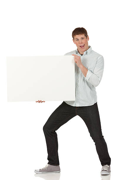 istock Man making funny face and holding a placard 185288639