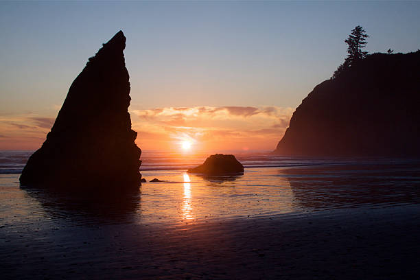 Sunset With Seatacks Over The Pacific Ocean