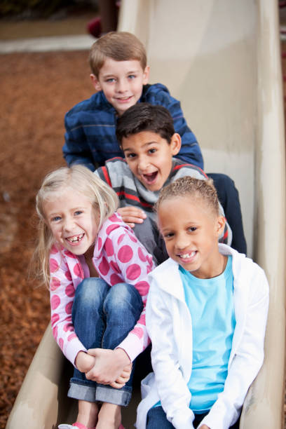 istock Children on playground slide 185289142