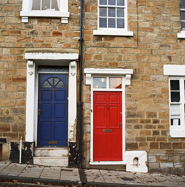 istock Crooked homes with red and blue doors 185289188
