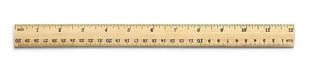 Inch-metric wooden ruler on white background