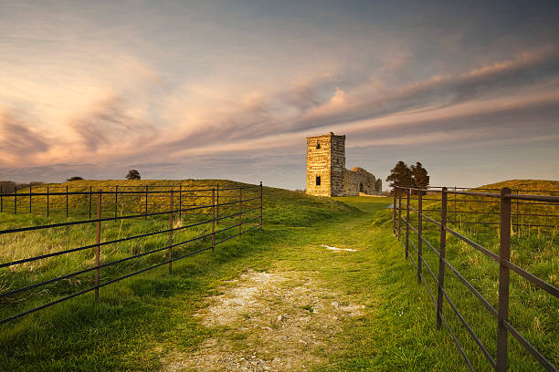 Ruined church at sunset Late evening at Knowlton Church. The remains of this Norman Church sit in the middle of an earth circle dating from 2500 BC. knowlton stock pictures, royalty-free photos & images