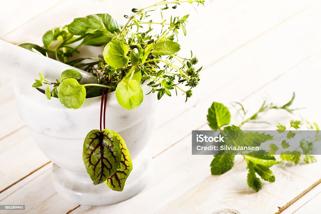 herbs with mortal and pestle "mixed herbs such as watercress, sorrel and thyme with mortar and pestlehere you can see more of my:" Chervil Stock Photo