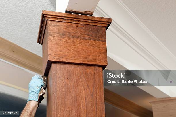 House Painter Applying Stain To A Cherry Column Stock Photo - Download Image Now - Applying, Architectural Column, Brown