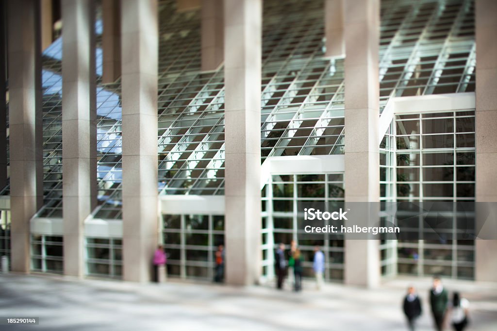 Office Workers in Downtown Courtyard (Tilt Shift) Selective-focus, tilt-shift shot of unidentifiable office workers standing in the courtyard of a marble and glass office tower in San Francisco Architectural Feature Stock Photo