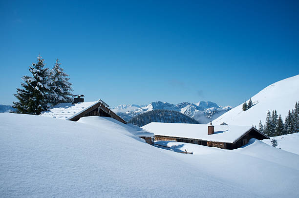 istock Snow covered huts in the Alps 185290194