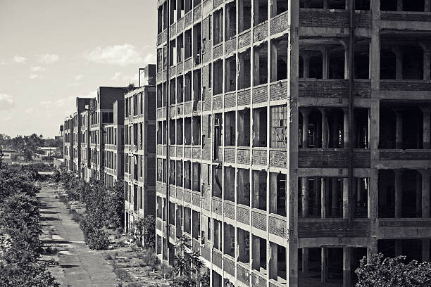 Abandoned Detroit Packard Plant A view from outside the abandoned Detroit Packard Plant.  This abandoned automobile manufacturing plant has been deteriorating since closing its doors in 1957. detroit ruins stock pictures, royalty-free photos & images