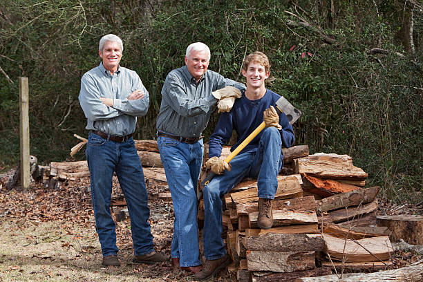 istock Three generation family chopping firewood 185290763