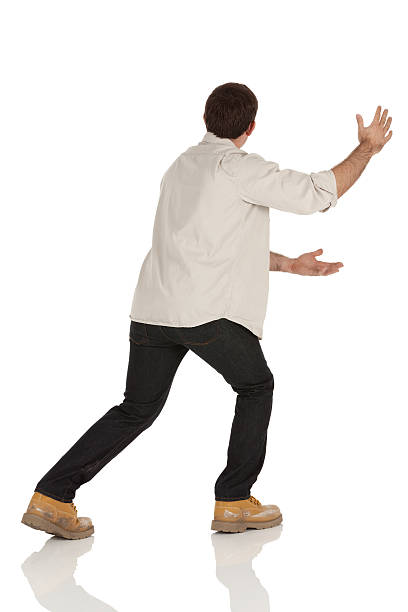 istock Rear view of a man gesturing 185290930