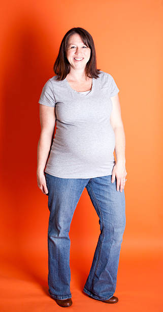 Pregnant Women Isolated on Orange Background