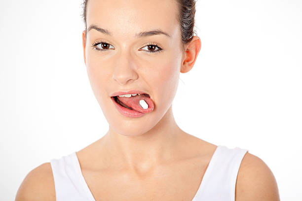 istock Beautiful Woman taking pill. 185291113