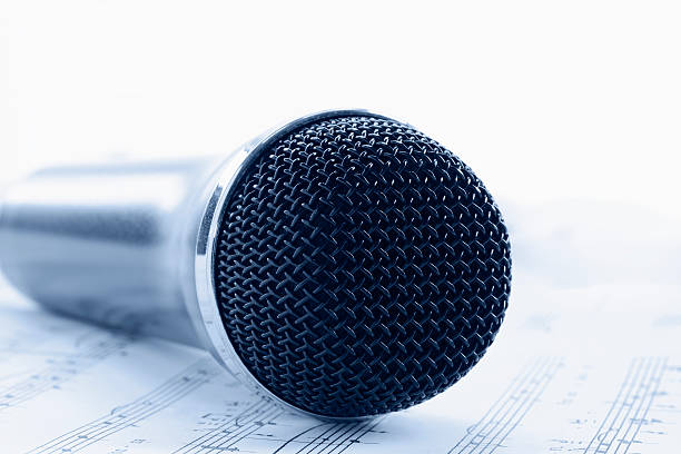 istock Blue Toned Microphone on Sheet Music with Copy Space Horizontal 185291282