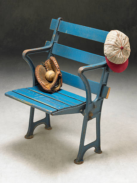 istock Antique stadium seat with old-time baseball items 185291700