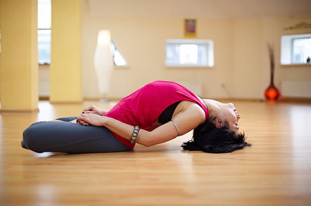 istock young woman doing yoga 185291826
