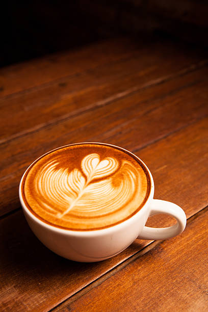 istock Latte art, coffee on the wooden desk as background. 185292722