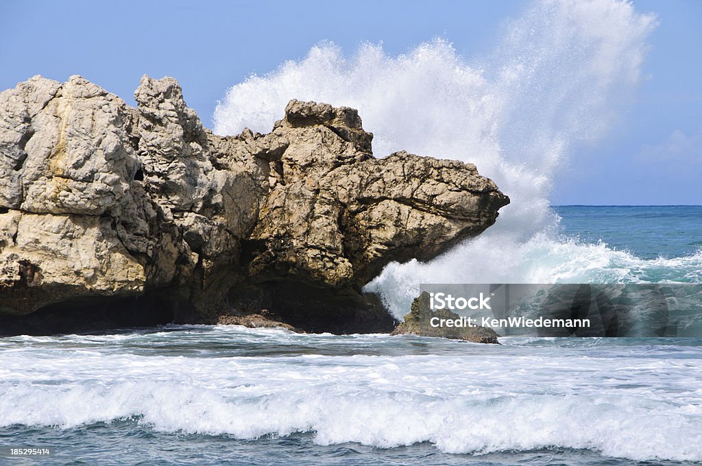 Caribbean Surf Powerful  waves smash against rock outcroppings on a warm November day on Labadee on the Caribbean coast of Haiti. Beach Stock Photo